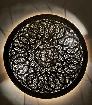 Handcrafted Moroccan brass wall light with bold arabesque pattern and central mandala design