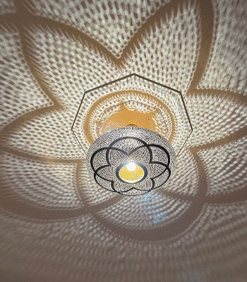 Handcrafted Moroccan brass ceiling light with intricate hand-pierced cut-out patterns and floral shadows