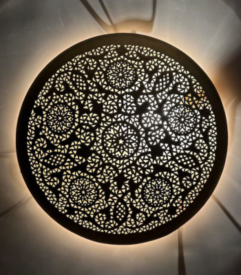 Moroccan brass wall light with celestial celestial-inspired geometric pattern hand-pierced with stars and crescents